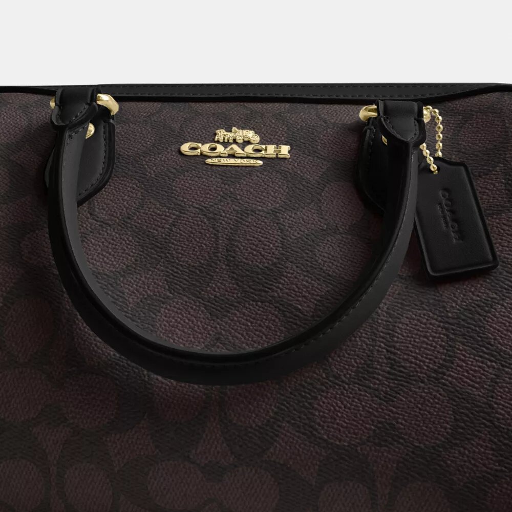 Bolso tipo cartera Rowan en Signature Canvas