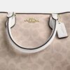 Bolso tipo cartera Rowan en Signature Canvas