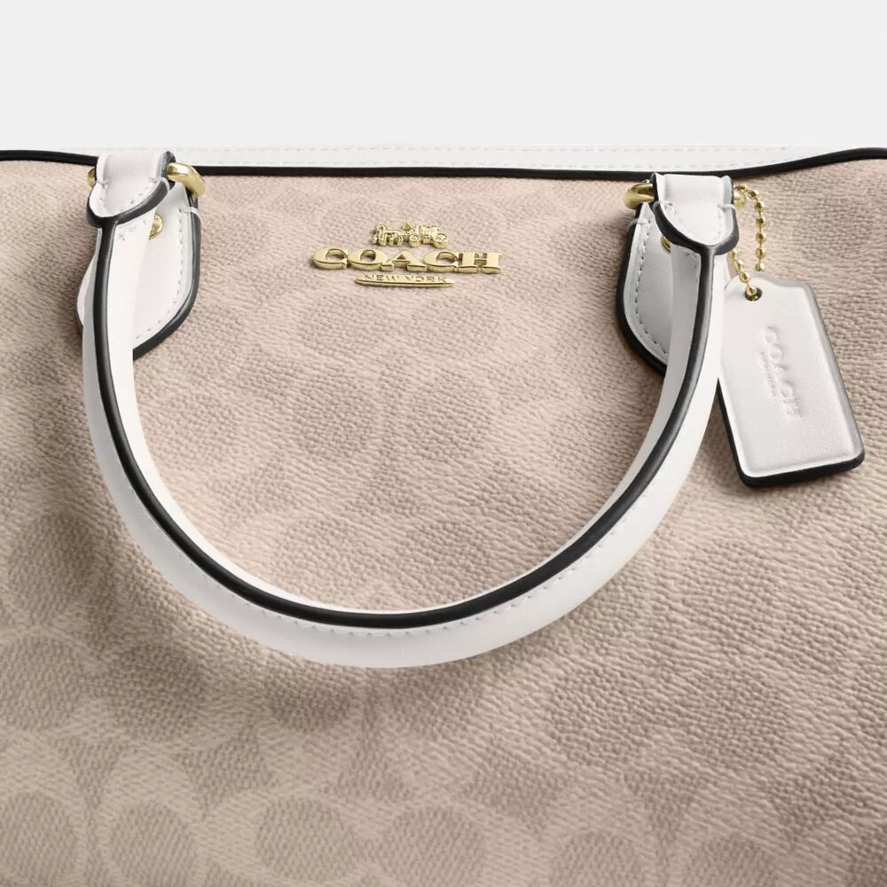 Bolso tipo cartera Rowan en Signature Canvas