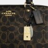 Bolso tipo cartera Rowan en Signature Canvas con Charms