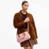 Bolso tipo cartera Rowan en Signature Canvas con Charms