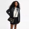 Bolso tipo cartera Rowan en Signature Canvas con Charms