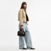 Bolso tipo cartera Rowan en Signature Canvas con Charms