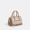 Bolso tipo cartera Rowan en Signature Canvas con diseño en bloques característico