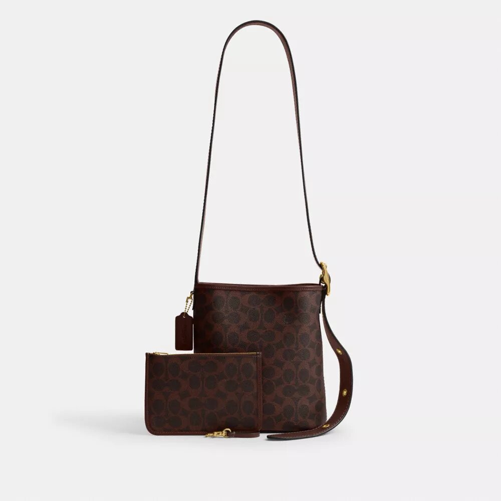 Bolso tipo cubo Bleecker 21 en Signature Canvas