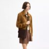 Bolso tipo cubo Bleecker 21 en Signature Canvas
