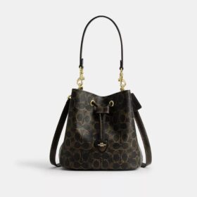 Bolso tipo cubo Rowan en Signature Canvas con Charms