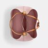 Bolso tipo cubo Rowan en Signature Canvas con Charms