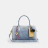 Bolso tipo satchel Rowan en denim desgastado con Charms
