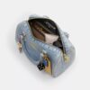 Bolso tipo satchel Rowan en denim desgastado con Charms