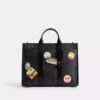 Bolso Wesley en Signature Canvas con parches