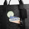 Bolso Wesley en Signature Canvas con parches