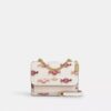 Bolsos bandolera Mini Klare con estampado de caramelos