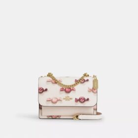 Bolsos bandolera Mini Klare con estampado de caramelos
