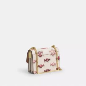 Bolsos bandolera Mini Klare con estampado de caramelos