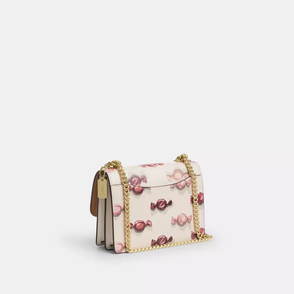 Bolsos bandolera Mini Klare con estampado de caramelos