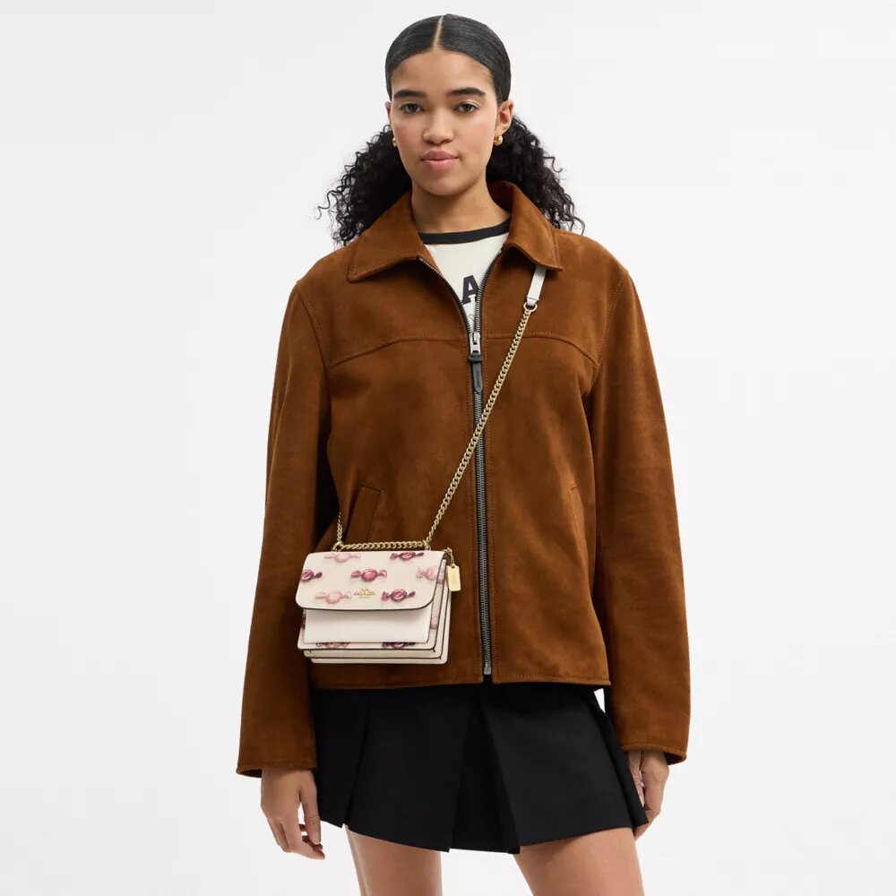 Bolsos bandolera Mini Klare con estampado de caramelos