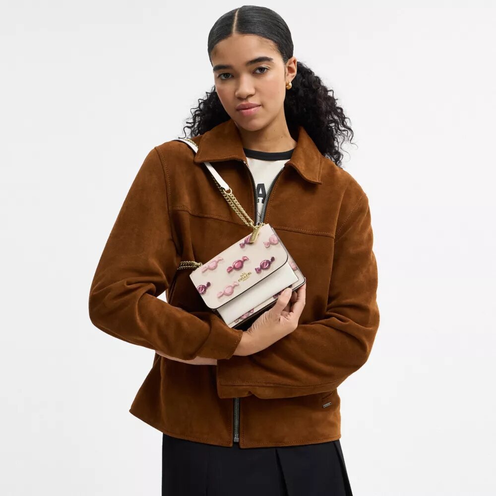 Bolsos bandolera Mini Klare con estampado de caramelos