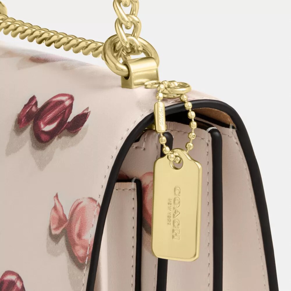 Bolsos bandolera Mini Klare con estampado de caramelos