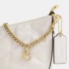 Bolsos de hombro Caitlin con acolchado y Charms