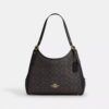 Bolsos de hombro Erin en Signature Canvas