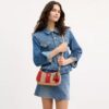Bolsos de hombro Teri con rayas y colgante