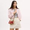 Bolsos de hombro Teri con rayas y colgante
