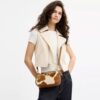 Bolsos de hombro Teri en piel de becerro con estampado de vaca