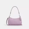 Bolsos de hombro Teri en piel exclusiva con colgante de corazón
