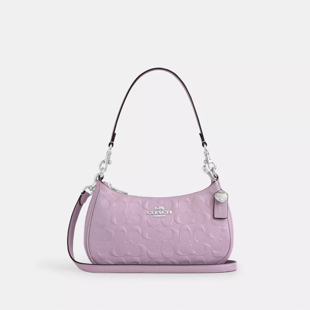 Bolsos de hombro Teri en piel exclusiva con colgante de corazón