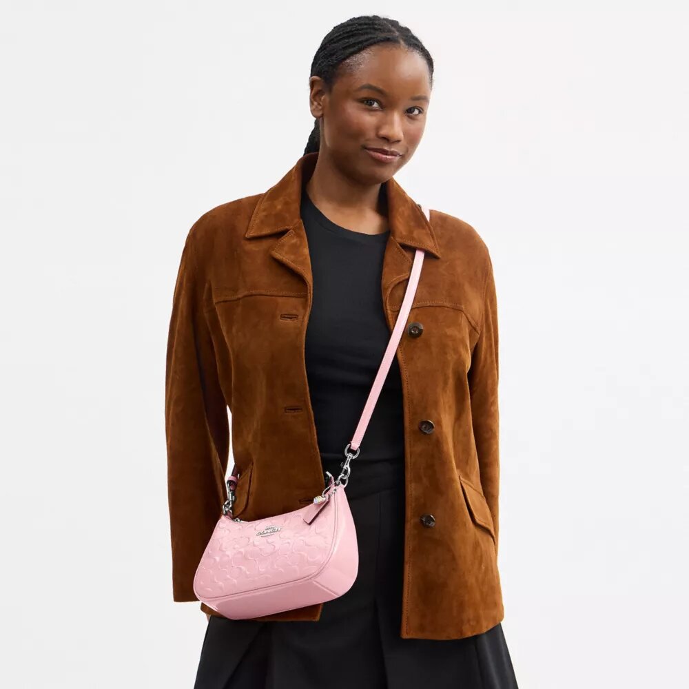 Bolsos de hombro Teri en piel exclusiva con colgante de corazón