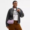 Bolsos de hombro Teri en piel exclusiva con colgante de corazón