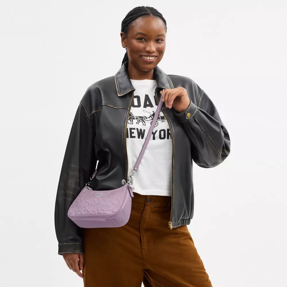 Bolsos de hombro Teri en piel exclusiva con colgante de corazón