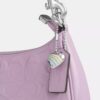 Bolsos de hombro Teri en piel exclusiva con colgante de corazón