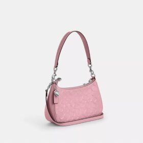 Bolsos de hombro Teri en piel exclusiva con colgante de corazón