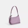 Bolsos de hombro Teri en piel exclusiva con colgante de corazón