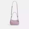 Bolsos de hombro Teri en piel exclusiva con colgante de corazón