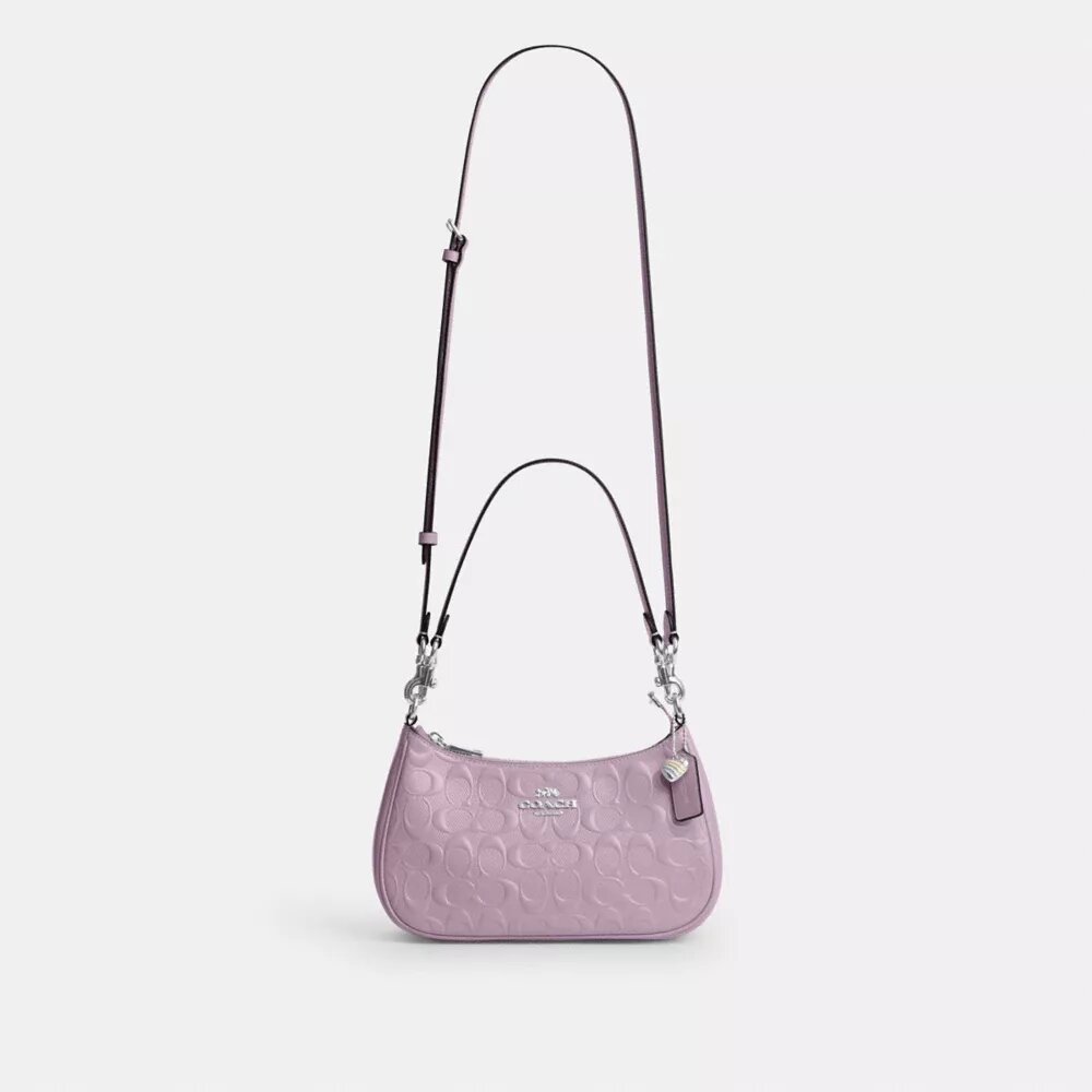 Bolsos de hombro Teri en piel exclusiva con colgante de corazón