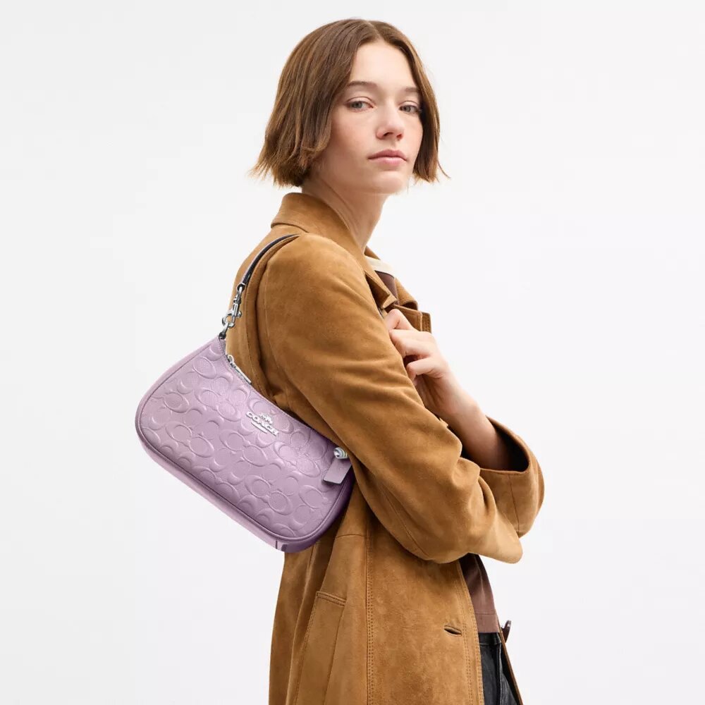Bolsos de hombro Teri en piel exclusiva con colgante de corazón