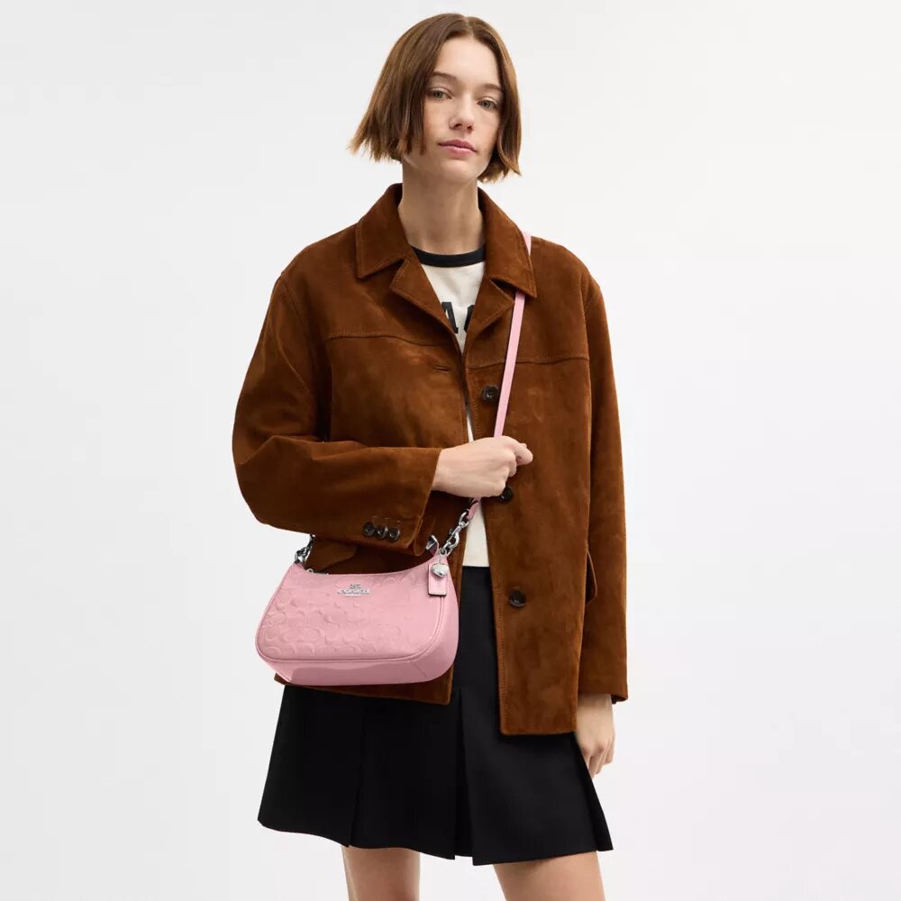 Bolsos de hombro Teri en piel exclusiva con colgante de corazón
