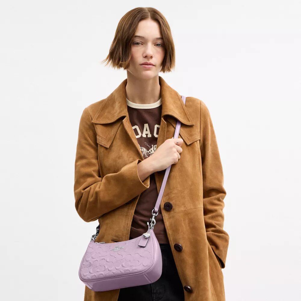 Bolsos de hombro Teri en piel exclusiva con colgante de corazón