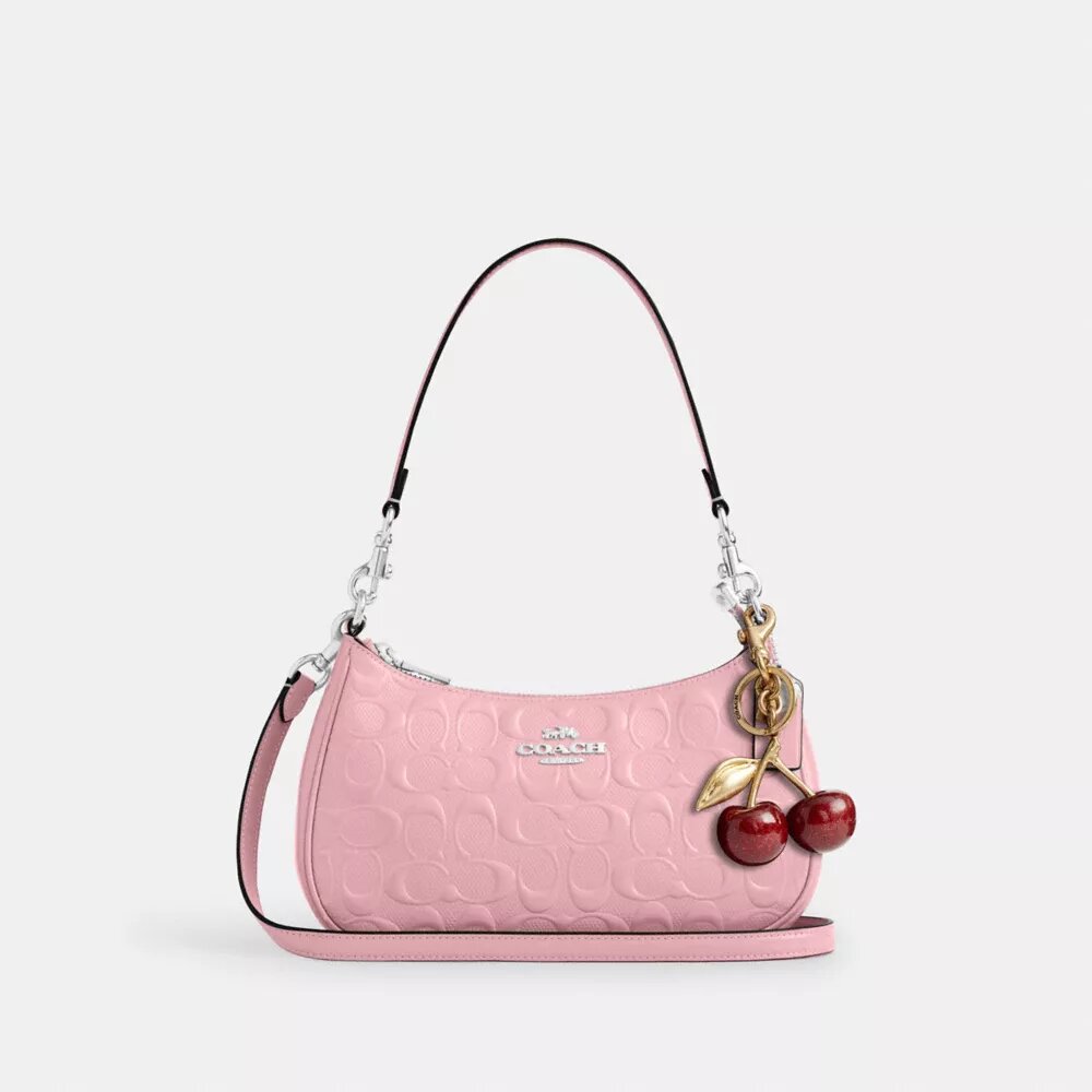 Bolsos de hombro Teri en piel exclusiva con colgante de corazón