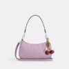 Bolsos de hombro Teri en piel exclusiva con colgante de corazón