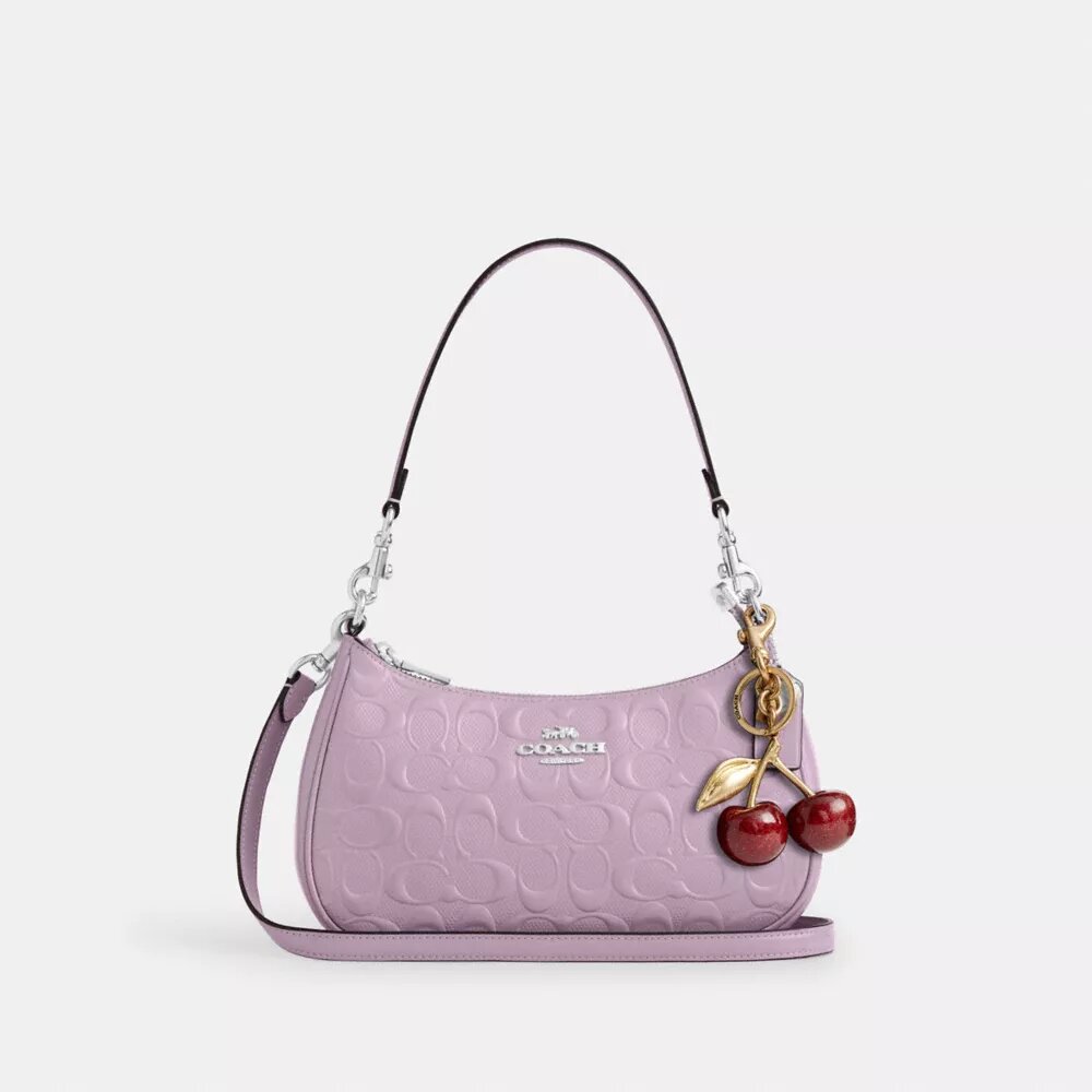Bolsos de hombro Teri en piel exclusiva con colgante de corazón