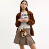 Bolsos de pulsera Ashton en piel de becerro con estampado de vaca
