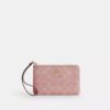 Bolsos de pulsera con cremallera en las esquinas en denim emblemático