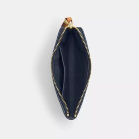 Bolsos de pulsera con cremallera en las esquinas en denim emblemático