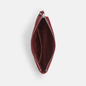 Bolsos de pulsera con cremallera en las esquinas en denim emblemático