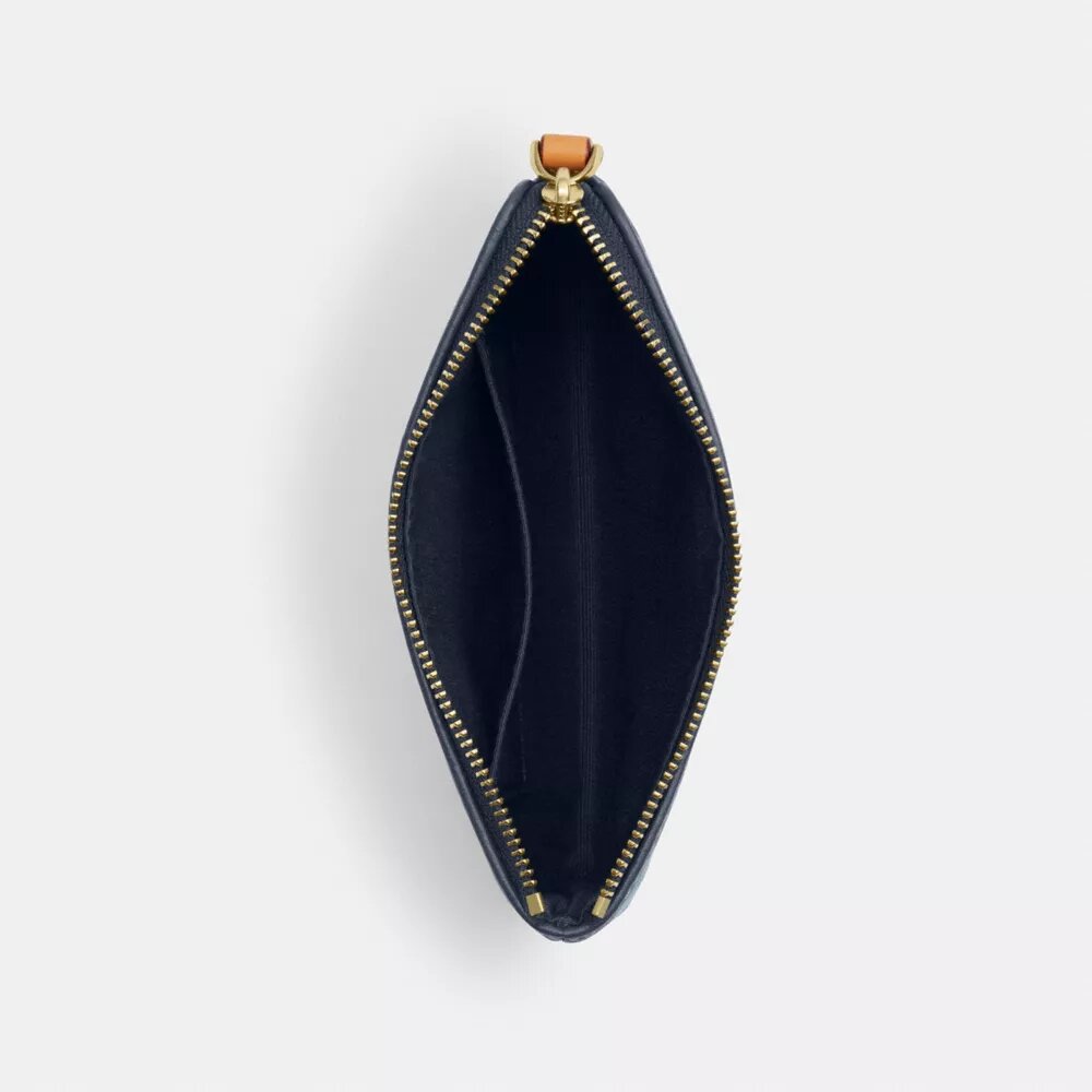 Bolsos de pulsera con cremallera en las esquinas en denim emblemático