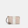 Bolsos de pulsera con cremallera en las esquinas, en Signature Canvas con rayas
